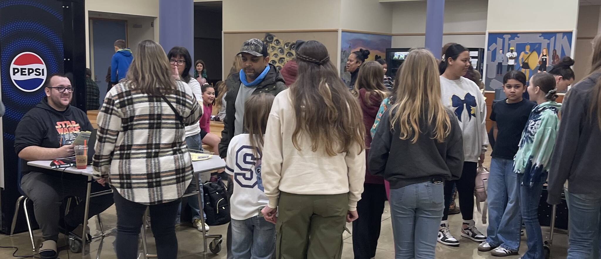 Before you can get a part, you have to fill out the paperwork. Here, Kenneth Turner greets parents and would-be actors prior to selections getting underway.