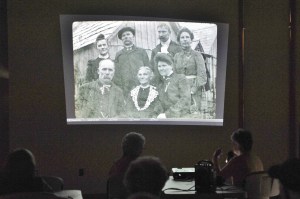 West End Historical Society member Adria Fuhrman shows slides of early days photos during the November historical society&rsquo;s meeting held at the RAC. The group intends to show more of the West End photos during the 2017 season. The group meets at noon the third Tuesday of each month at the Rainforest Arts Center. The public is invited. Photo by Lonnie Archibald