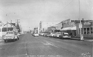 A postcard featuring downtown Forks, the Art&rsquo;s Place sign can be seen on the right side of the photo. Bob Stark has recreated a similar sign that will go over the door of the newest display at the Forks Timber Museum.