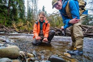 Aquatics ecologist Emily Howe and Forest Ecologist Ryan Haugo checking out the Hoh River – photo credit Joel Rogers