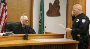 Judge John Doherty prefaced the swearing in ceremony with the statement that he usually doesn&rsquo;t get to do many fun things in the court room, he added it was an honor to take part in the swearing in of Mike Rowley as Forks&rsquo; next Police Chief. Photo Christi Baron