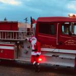 Santa rides in style with a little blue sky to make the outing most enjoyable.
