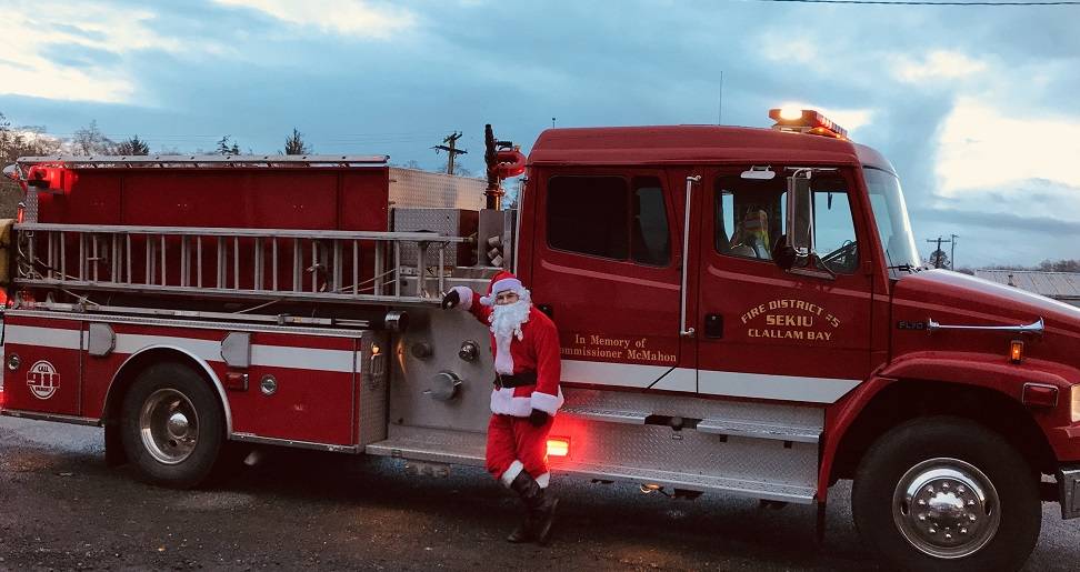 Santa rides in style with a little blue sky to make the outing most enjoyable.