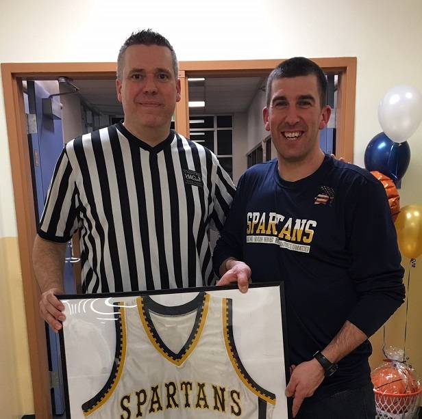 Community Corrections Supervisor Brian Frazer (left) with Community Corrections Officer Kasey Ulin. Ulins high school basketball jersey will be on permanent display at Forks High School. Photo Credit: Kyle Weakely, Forks High School Athletic Director