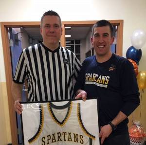 Community Corrections Supervisor Brian Frazer (left) with Community Corrections Officer Kasey Ulin. Ulins high school basketball jersey will be on permanent display at Forks High School. Photo Credit: Kyle Weakely, Forks High School Athletic Director