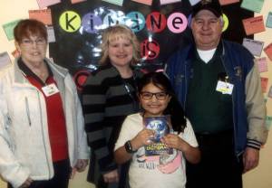 From left, Lynn Barnes, Elks Drug Awareness Chairman, Lexi Cisneros holding a dictionary, Kim Northcut third-grade teacher, and Chuck Jennings Elks Youth Activities Chairman. Submitted Photo