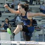 Brady Edwards rushes over the hurtles.