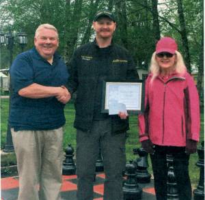 Jerry and Margaret King, owners of Alder Grove present Joey Roberts, manager, with an $1,800 check and a Certificate of Appreciation for his 18 years of service to Alder Grove. Submitted Photo