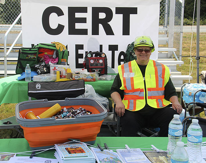 Community                                 Emergency Response Team (CERT) member volunteer Jodi Riker was on hand to share literature on surviving a disaster, candy and cold water on what was a beautiful sunny day on Saturday. Photos Christi Baron