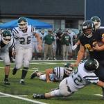 Tristen Pisani (34) had a good game against the Roughriders. Forks defeated Port Angeles 28 to 8. Also in on the action is Spartan Brett Moody (3). Photos by Lonnie Archibald