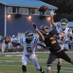 Spartan receiver Brett Moody eyes an overthrown pass in the end zone while Port Angeles defenders cover.