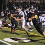 Spartan Colby Demorest (24) runs around the end for a good gain down to the one-yard line.
