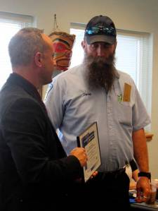 CTS board member Kevin Gallacci (L) presents Clallam Transit operator David Larrabee with a certificate recognizing him as the winner of the 35-foot Coach Event at the North Olympic Regional Bus Roadeo. Larrabee drives the early shift between Forks and Port Angeles.