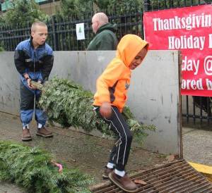 Zaiden Morales and Dax Baysinger assisted other West End Youth League volunteers last Saturday afternoon as the groups annual tree sale fundraiser got underway outside Forks Outfitters. Douglas Firs (green tags) are $32.95 and Noble Firs (blue tags) are $47.95. Funds raised from the sale of the trees go to benefit youth sports activities in our community. Photo Christi Baron