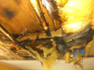 Insulation is pulled away from charred wood, the result of an electrical fire on New Years Eve at a mobile home at Castle Rock Mobile Home Park. Submitted photo