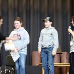 Sarah Decker makes the announcement as School Superintendent Diana Reaume congratulates Rowan Ball and Nate Dahlgren on achieving 4.0s for both first and second quarters. Also achieving a 4.0 for both quarters but not pictured was Keira Johnson.