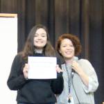 Hailey Ekegren had perfect attendance for the first semester, seen here with Sarah Decker who filled in as master of ceremonies.
