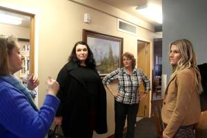 Jennifer Pelikan caseworker for Sarges Place speaks with several of Senator Patty Murrays staff members Chelsea Clayton, King County Director of Veterans Affairs, (In black) across from her is Colleen Bryan, Kitsap and Olympic Peninsula Director for Murray, as Cheri Tinker Executive Director of Sarges Place looks on.