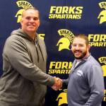 New Forks High School Football coach Trevor Highfield is welcomed to FHS by Spartan Athletic Director Kyle Weakley. Photo Christi Baron
