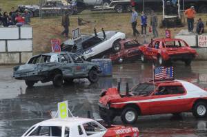 Some rode piggyback while others had front end alignment problems at the annual Demo derby held last Thursday at the Tillicum Park arena. Photo by Lonnie Archibald