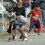 There was lots of candy along the parade route for kids as is evident here as children rush to the goodies.