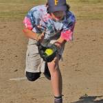 Forks Misfits pitcher Walker Rondeau makes a running catch of a pop up against LaPush who Forks defeated during the Quileute days Youth Softball Tournament held in LaPush.