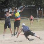 Hit For Brains shortstop David Burr leaps for a high throw to catch The Hanger runner Jack Graul out, as he was going back to second. Hit For Brains defeated The Hanger 10 to 9 Sunday to win the championship of the Fred Orr Tournament.