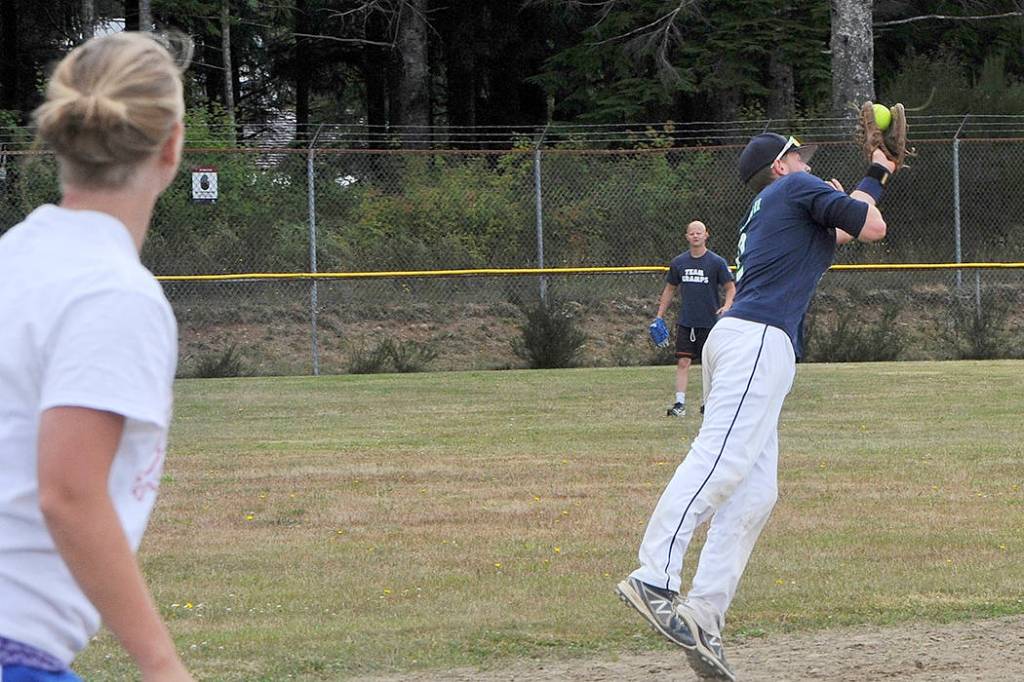 Forks Merchants shortstop Parker Browning makes a catch of a line drive against Hit For Brains Saturday who the Merchants defeated 13-12. Hit For Brains defeated the Merchants Sunday however and went on to win the Fred Orr Tournament.