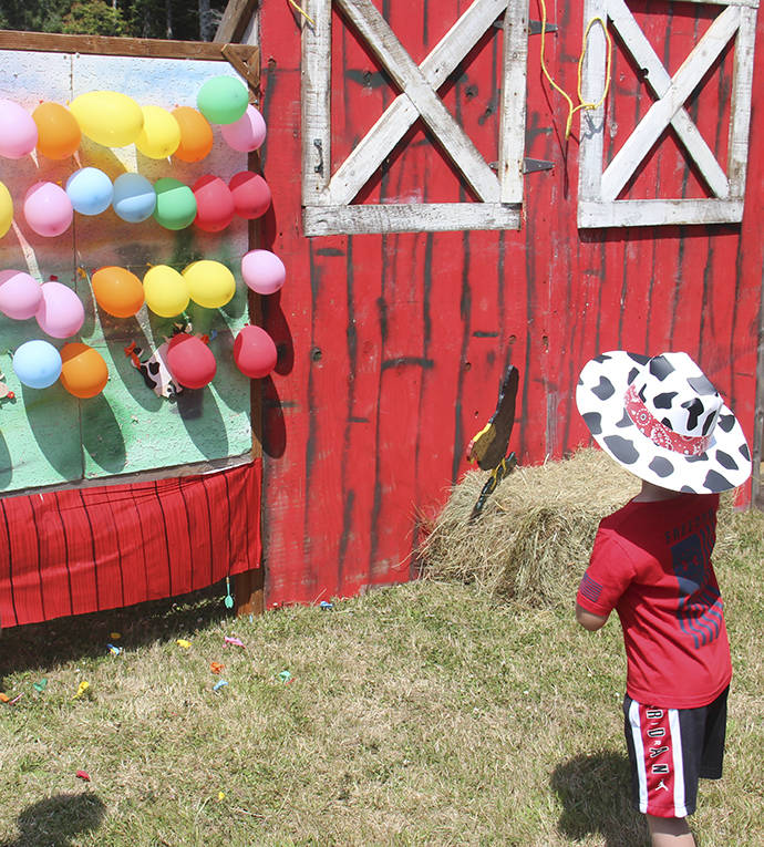 Ole Dead-Eye the dart thrower was popping balloons left and right at one of the many games and activities offered last Saturday.