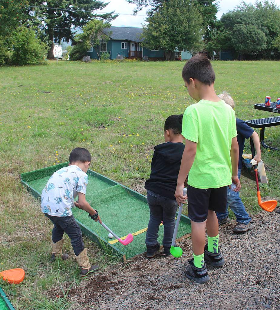 Above: Was it a hole in one? this bunch was getting in a little time on the green during the Sunshine and Rainbows Carnival.
