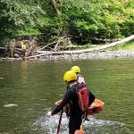 Crossing the river with equipment.
