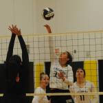 Bruin Amber Swan (33) hits against Chief Kitsap Academy Thursday evening in Clallam Bay where the Bruins defeated Kitsap 25-7, 25-10 and 25-10. Looking on are Bruins Rainee Signor and Patience Swan (11).
