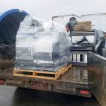 Lions Club members Tim Fletcher and Brian Olson unload E-Cycled items in Tacoma. Submitted Photos
