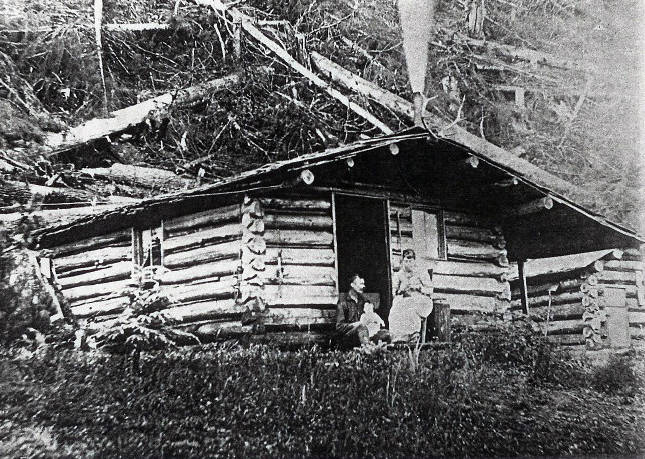 The Hopkins family cabin was located at the foot of the hill now called Bigler. In this photo Mr. and Mrs. Hopkins with baby Cecile. Photos were taken by Elmer Hopkins Georges uncle.