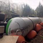 Workers late last Tuesday afternoon deployed large airbags to right an overturned propane tank-trailer and semi-truck that was driven into a ditch Monday evening 4 miles south of Forks on U.S. Highway 101. The tanker was fully loaded with 10,000 gallons of propane that was transferred to another tanker. WSP Photo