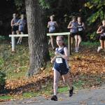 Forks Madelyn Archibald got off to a quick start and never looked back defeating the second-place finisher by two and a half minutes during this Evergreen League 1A cross country championship run at Lake Sylvia in Montesano. Pictured here running in second place is teammate Karen Ensastegui who finished seventh. Photo by Lonnie Archibald