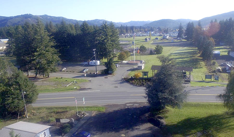 Tillicum Park -now- in this drone photo taken from across Highway 101 shows the sign telling about the Forks fire and it is just about the only thing recognizable. The burned-over hills now covered with trees. Photo Bob McIntyre