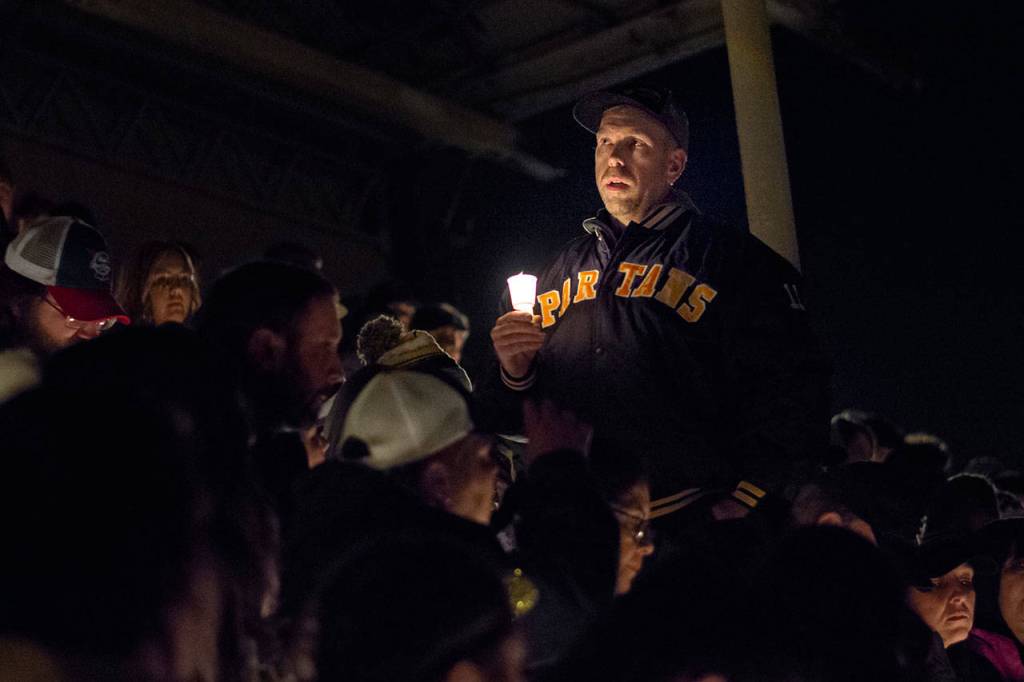 A man shares a story about Tristen Pisani during a vigil at Spartan Stadium in Forks on Thursday. (Jesse Major/Peninsula Daily News)
