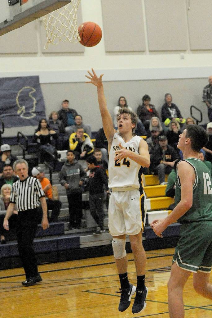 Varsity guard Spartan Logan Olson hits on this jumper.