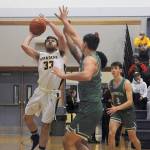 In varsity action Forks Skyler Steffen (33) scores on this drive to the basket.