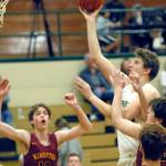 High school boys basketball games will feature a 30-second shot clock beginning next season. The move, part of a number of rules changes adopted by the WIAA, standardizes the shot clock for boys and girls basketball. (Keith Thorpe/Peninsula Daily News file)