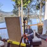 Kimberly Knudson, a first-grade teacher in the Quilcene School District, records lessons and conducts Zoom calls with students on her deck.