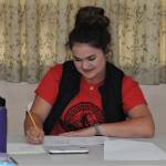 FHS class of 2020 member Rian Peters along with other students, not pictured, took bids while keeping records at the Forks Congregational Church during the QVSA online auction. Photo by Lonnie Archibald