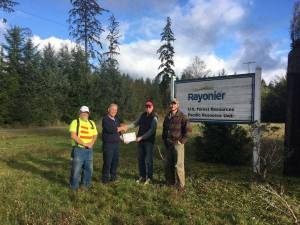 Rayonier employees Mike Leavitt, Dennis Cox, and Griffin Ollar with Forks Lions Club member John Calhoun, who is second from the right. Submitted Photo