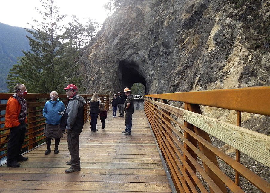Ribbon Cutting attendees check out the bridge, as several Bruch and Bruch employees took photos. Bruch and Bruch Construction of Port Angeles was the contractor for the project. Photo Christi Baron