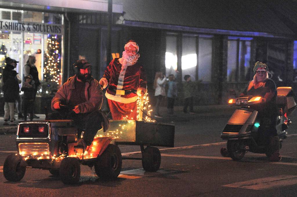 Steven Grant Hurley brought a Santa look-a-like with his riding lawnmower and trailer. This is his second year being in the parade. It was the first year for Jessica Hurley, on the scooter, seen here behind him, she said she had a great time!