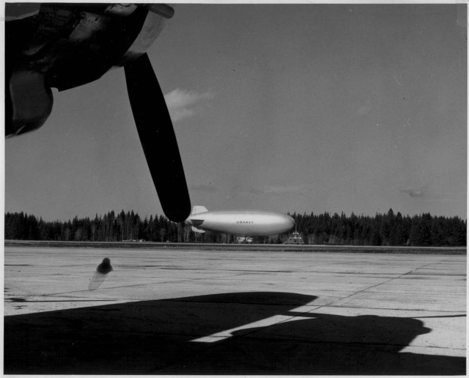 Blimp on the runway.