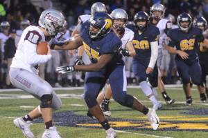 Forks Trey Baysinger (55) tackles Montesano quarterback Sam Winter during a 2019 contest at Spartan Stadium. Baysinger says hes been learning new skills in the construction trades and leaning on his family to get through the pandemic. (Lonnie Archibald/for Peninsula Daily News file)