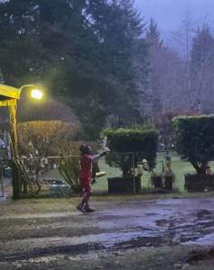 Ruth greeting Seahawks fans with her I hate Seahawks sign at her home on Sunday evening.