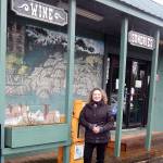 Carrie Dahlgren Merrill stands outside the future Beaver Grocery Store. Plans include touching up the mural behind her. Photo Christi Baron